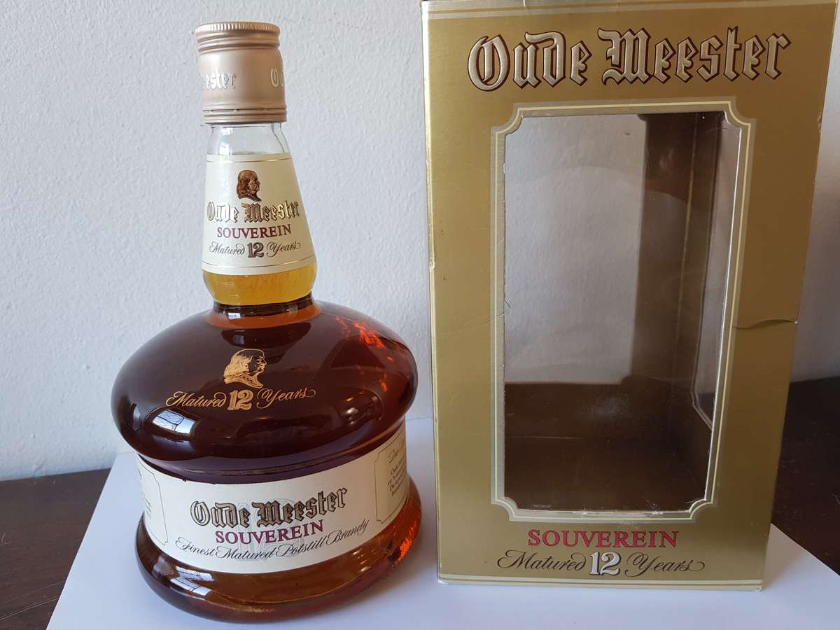 VINTAGE OUDEMEESTER SOUVEREIN POTSTILLED 12 YEAR OLD BRANDY IN UNIQUE SHAPED DECANTER.