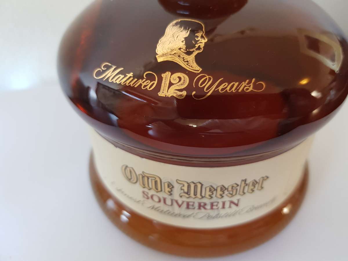 VINTAGE OUDEMEESTER SOUVEREIN POTSTILLED 12 YEAR OLD BRANDY IN UNIQUE SHAPED DECANTER.
