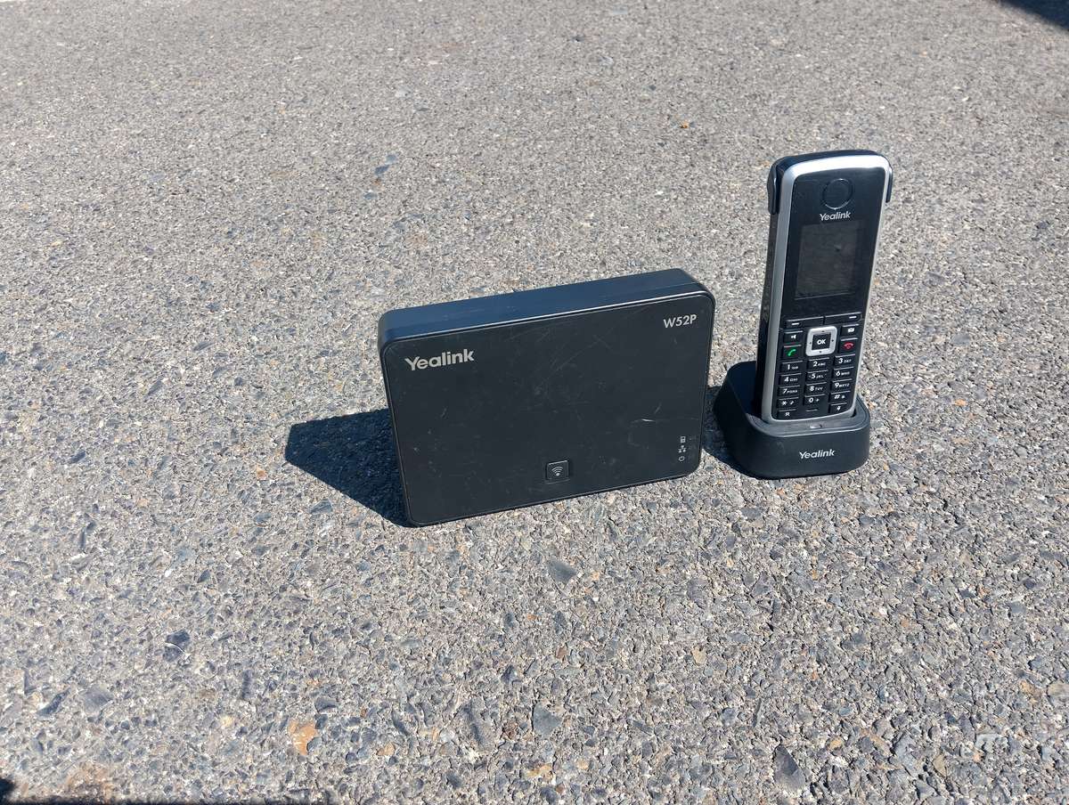 Yealink W52P Cordless phone with base, chargers, and Dect cordless handset