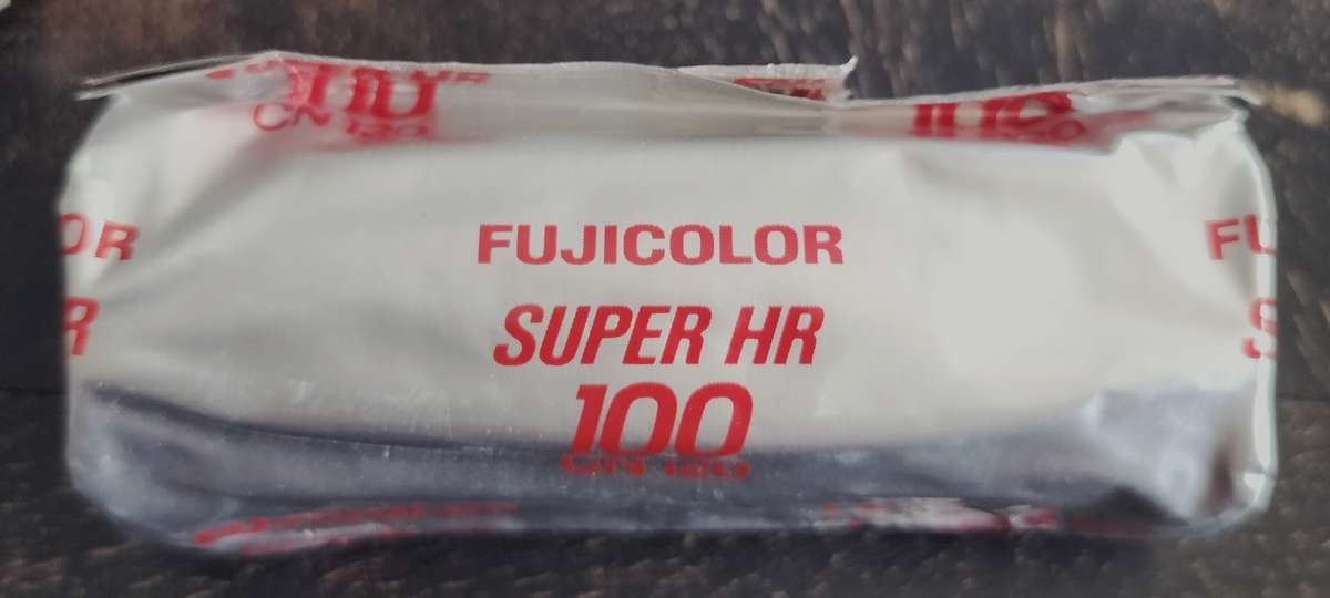 Unopened Fujicolor Super HR100 roll film spool