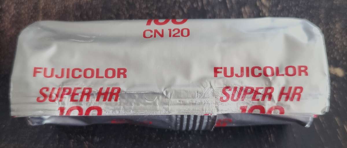 Unopened Fujicolor Super HR100 roll film spool
