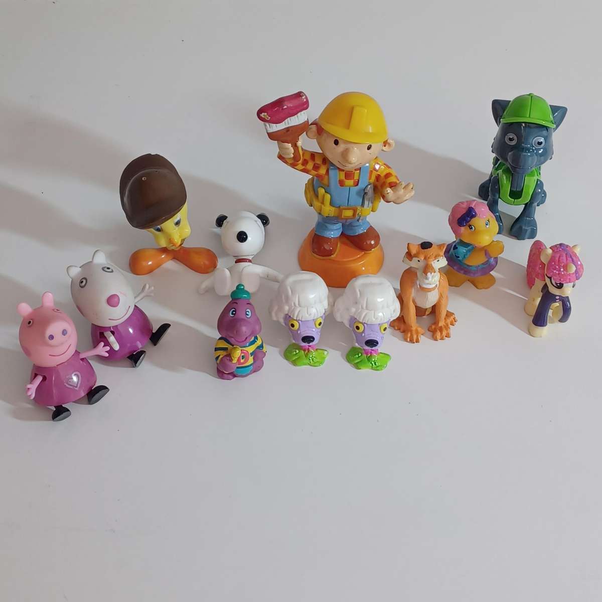 collection of figurines from various children's franchises