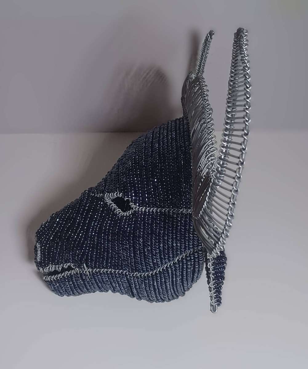 beaded and wire-frame African buffalo head wallpiece (38cm x 23cm x 20cm)