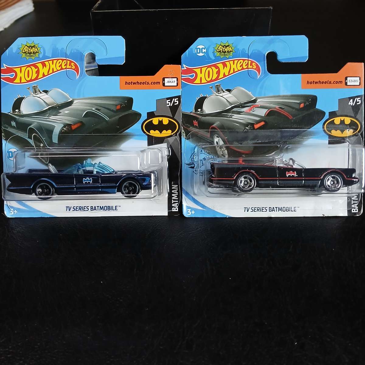 two Hot Wheels diecast models of the Batmobile from the 1966 Batman TV series