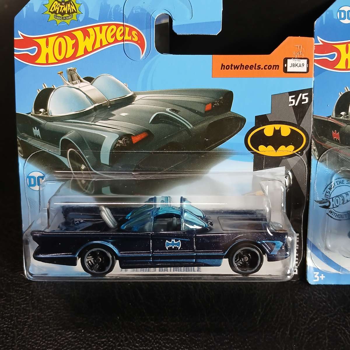 two Hot Wheels diecast models of the Batmobile from the 1966 Batman TV series