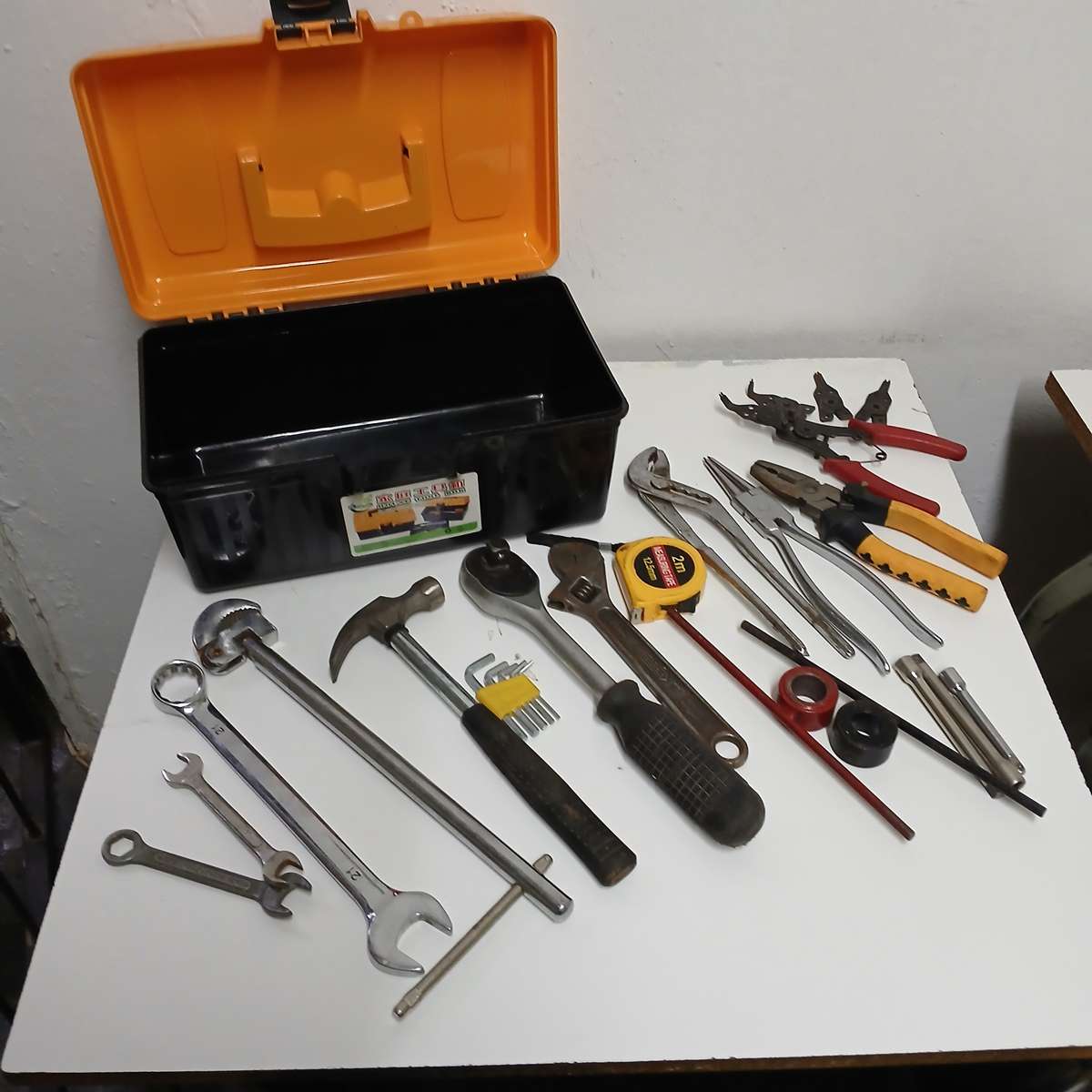 toolbox with various hand tools.