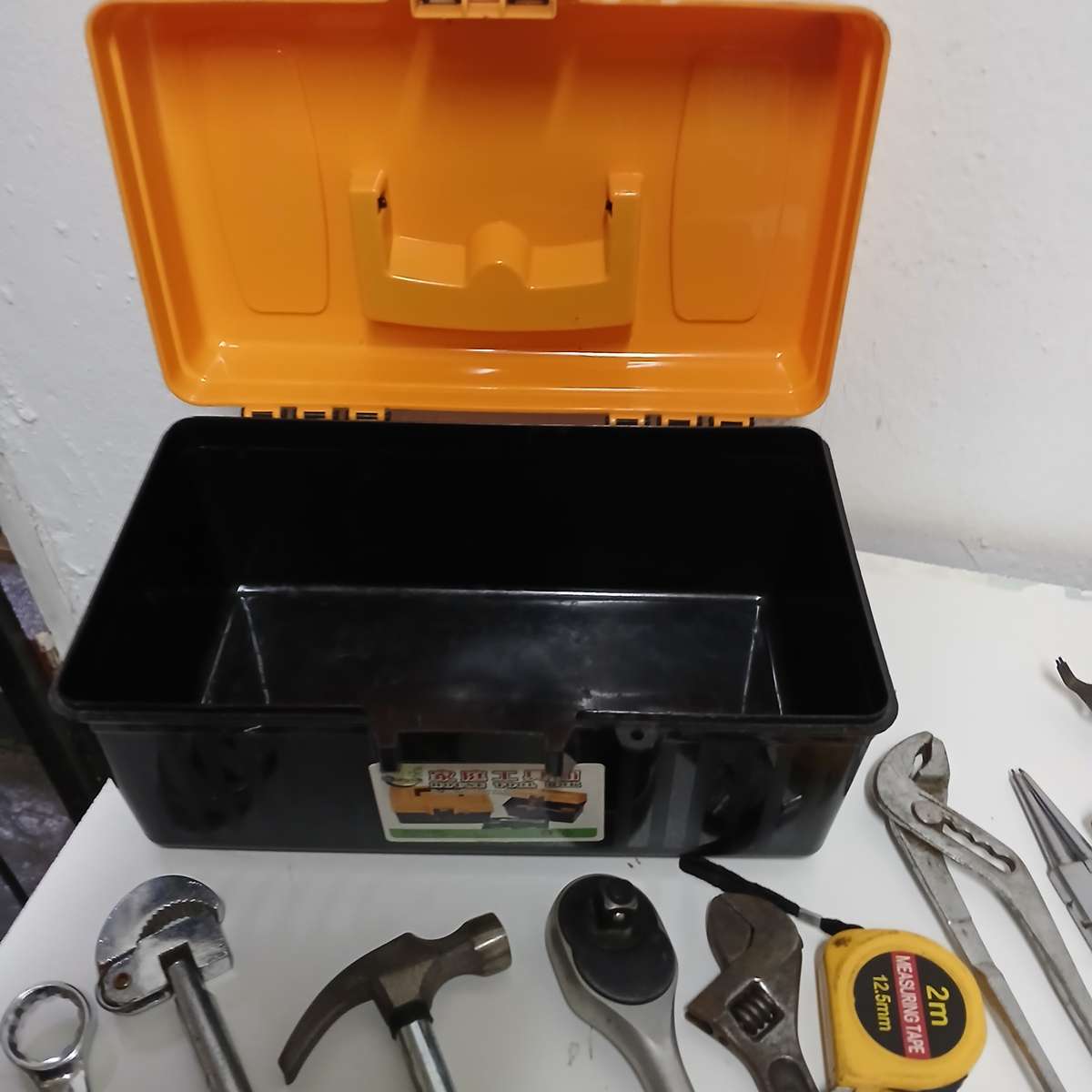 toolbox with various hand tools.