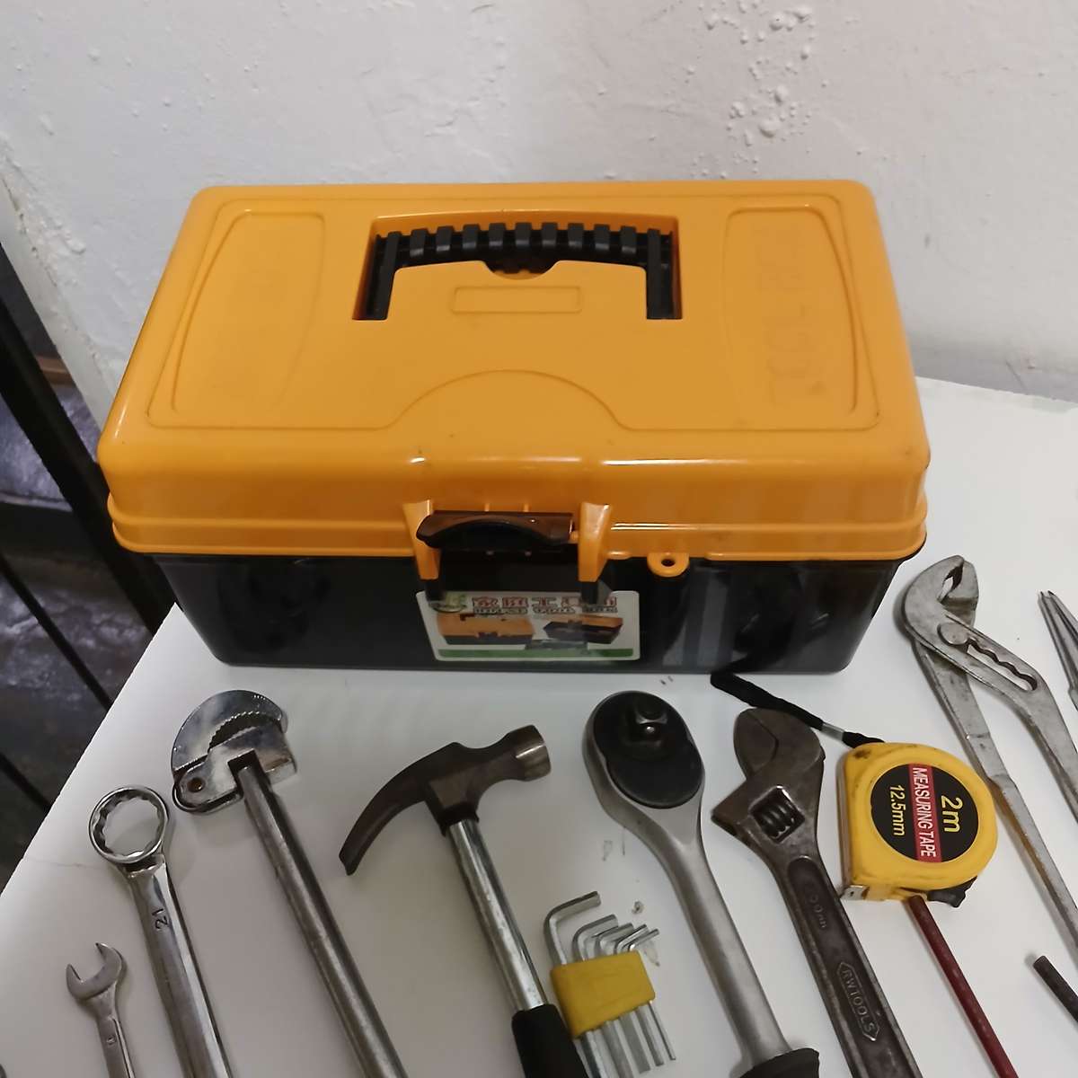 toolbox with various hand tools.
