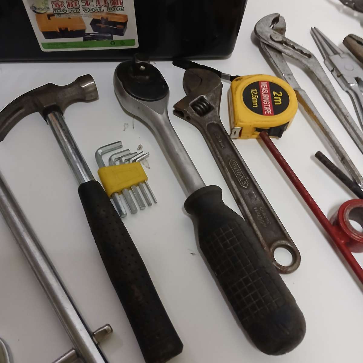 toolbox with various hand tools.