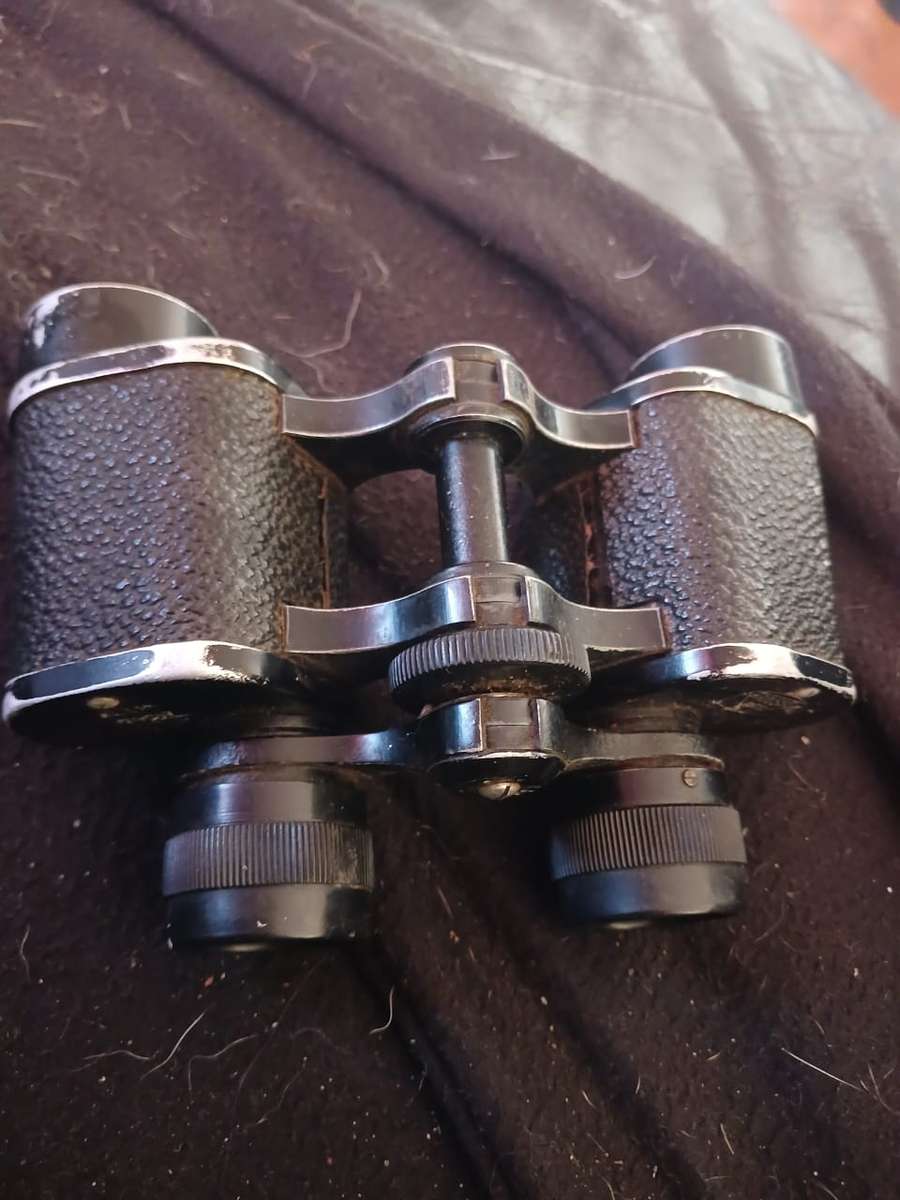 Antique binoculars with leather carry bag