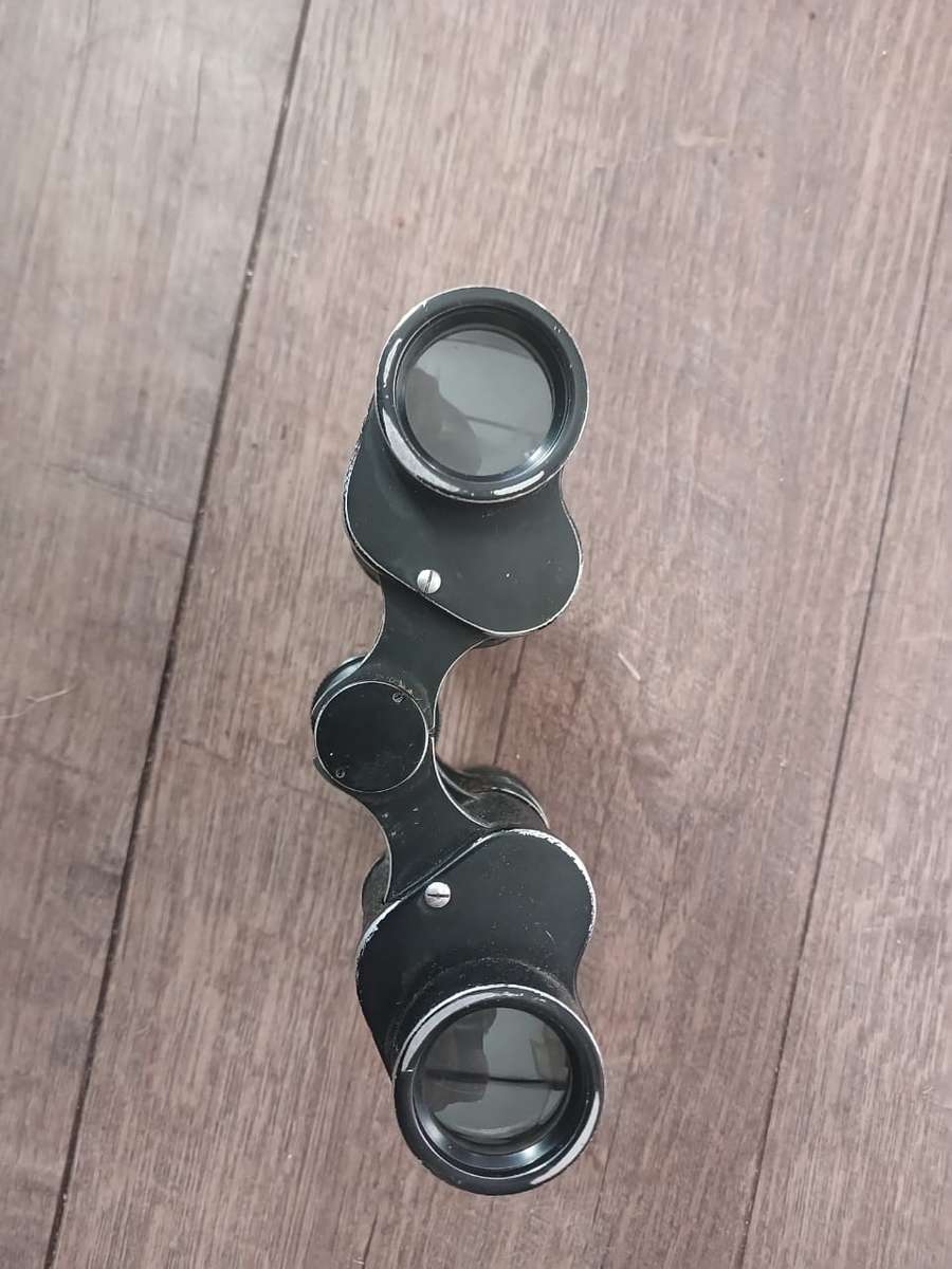 Antique binoculars with leather carry bag