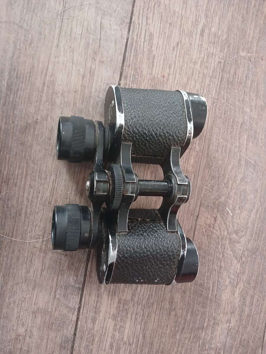 Antique binoculars with leather carry bag