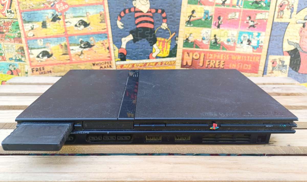 Playstation 2 - Black Slim c/w 2 x Controllers, AV Cable & Power Cord + 4 Games