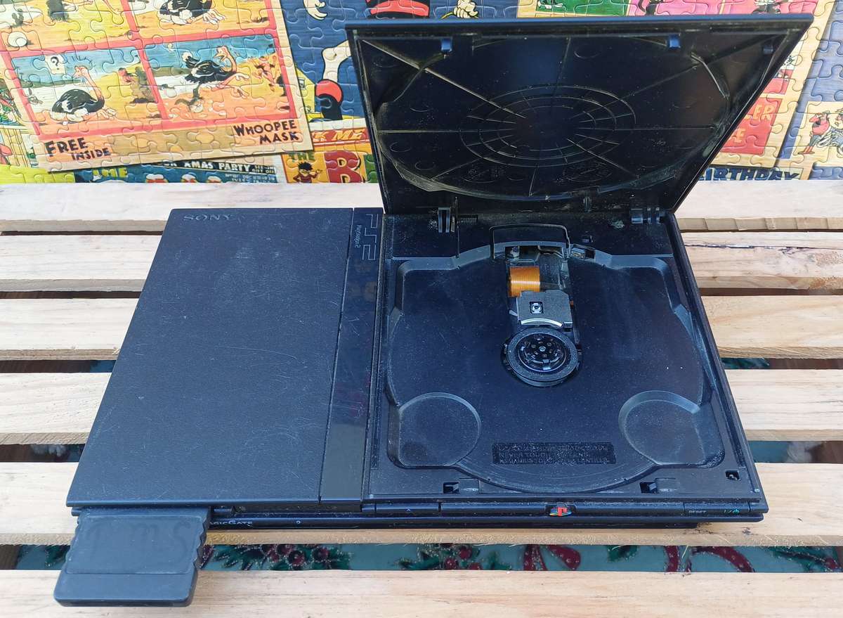 Playstation 2 - Black Slim c/w 2 x Controllers, AV Cable & Power Cord + 4 Games