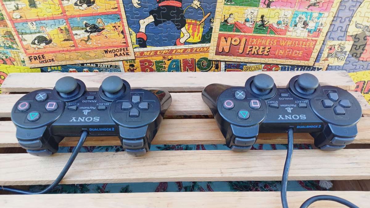 Playstation 2 - Black Slim c/w 2 x Controllers, AV Cable & Power Cord + 4 Games