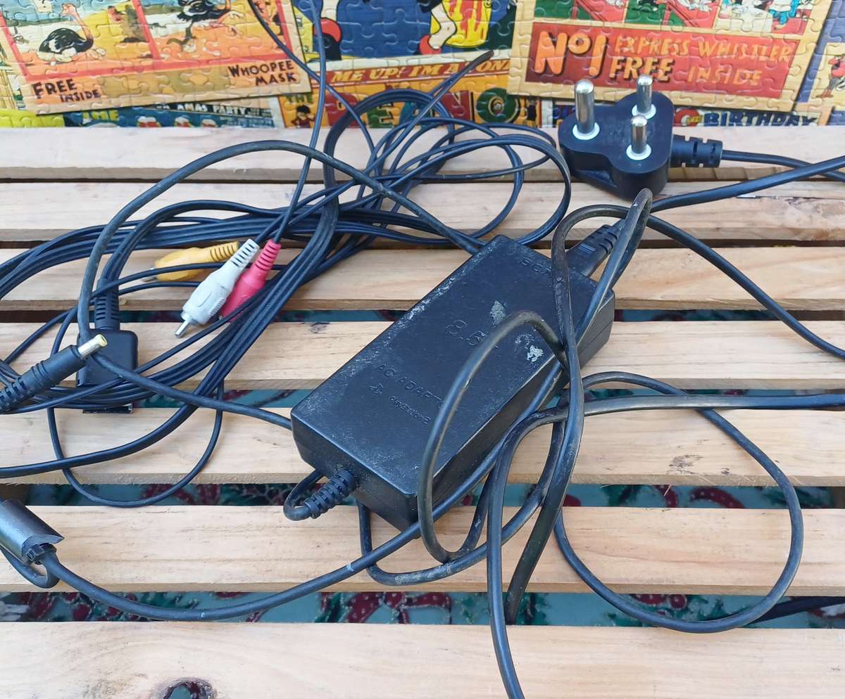 Playstation 2 - Black Slim c/w 2 x Controllers, AV Cable & Power Cord + 4 Games