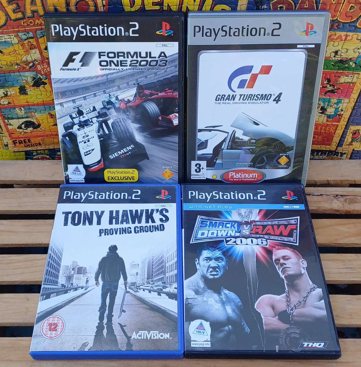 Playstation 2 - Black Slim c/w 2 x Controllers, AV Cable & Power Cord + 4 Games