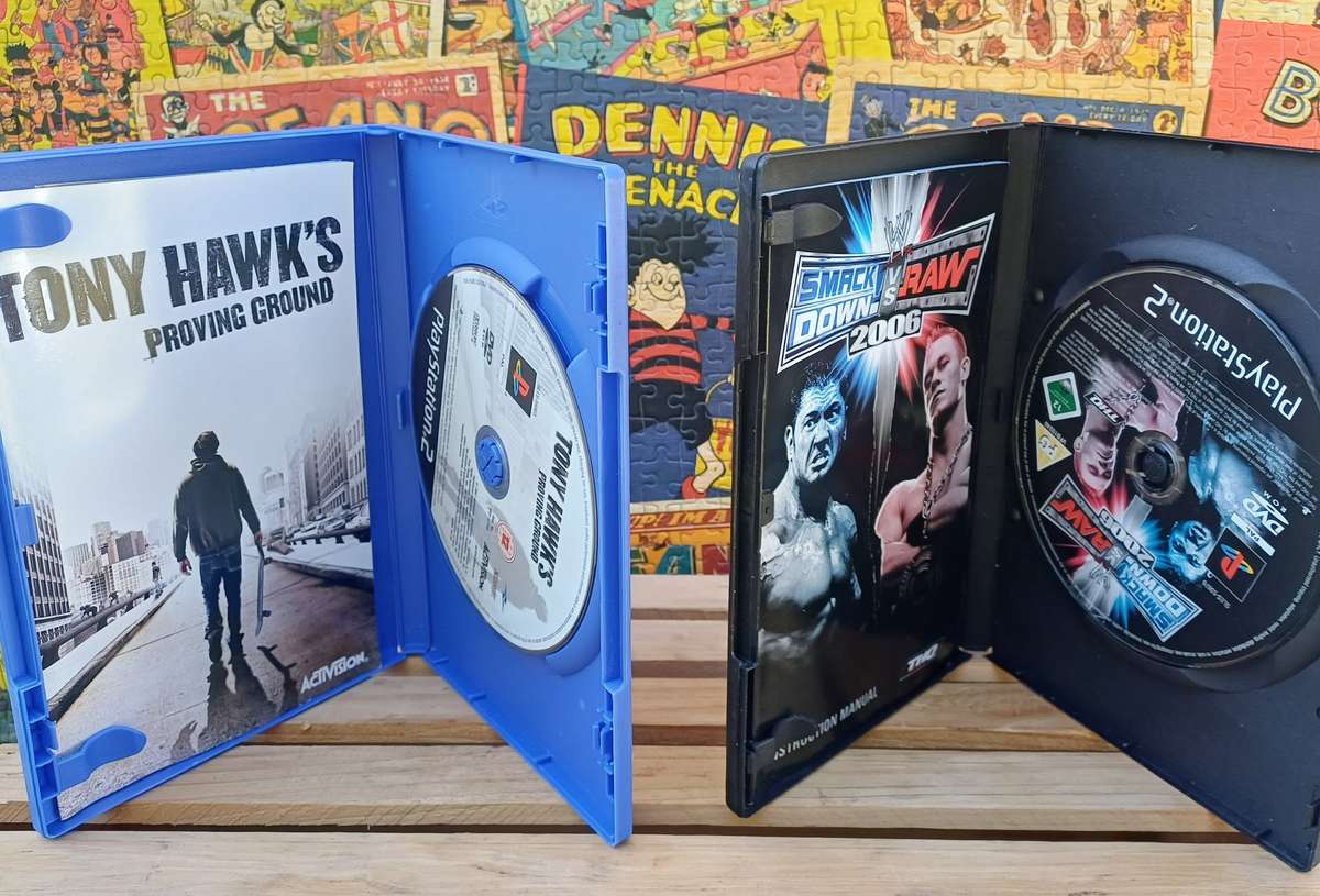 Playstation 2 - Black Slim c/w 2 x Controllers, AV Cable & Power Cord + 4 Games