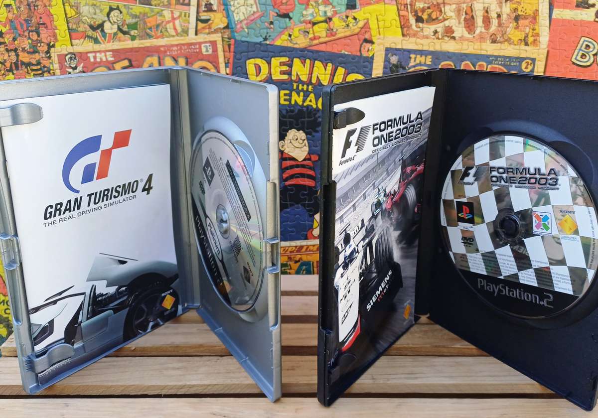 Playstation 2 - Black Slim c/w 2 x Controllers, AV Cable & Power Cord + 4 Games