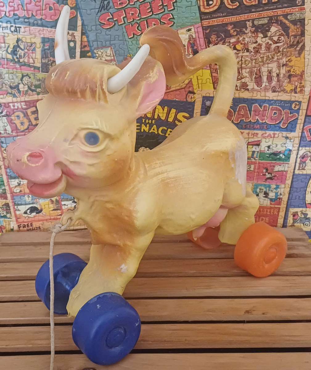Vintage Rolling Cow Toy