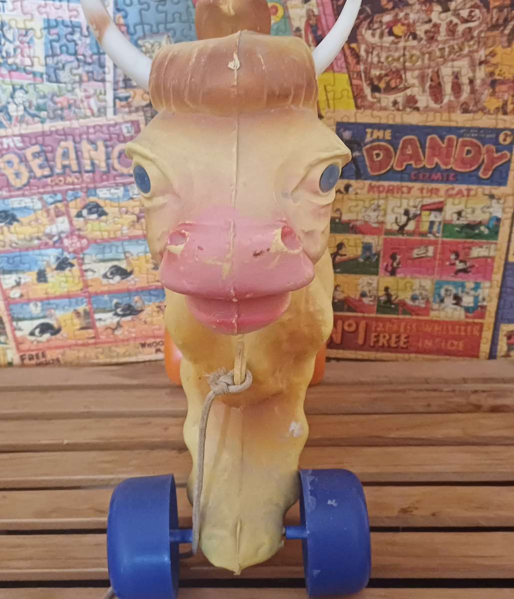 Vintage Rolling Cow Toy