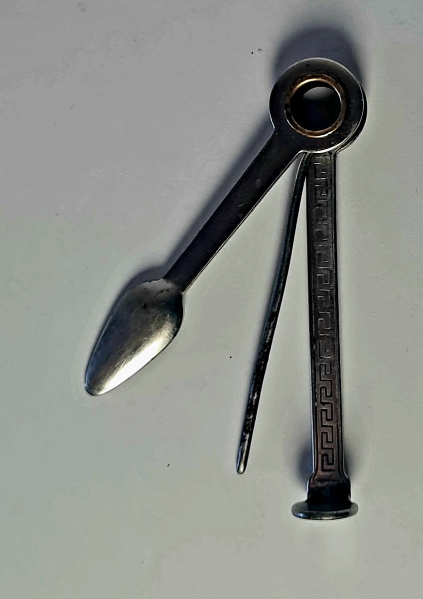 Smoking pipe, pipe cleaning tool and tobacco pouch.