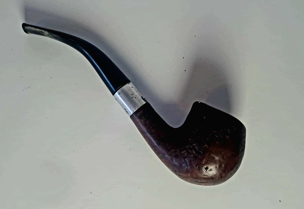 Smoking pipe, pipe cleaning tool and tobacco pouch.