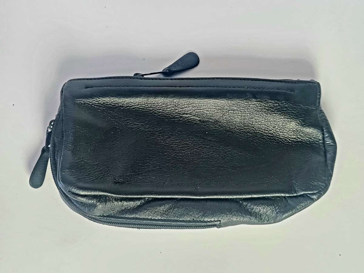 Smoking pipe, pipe cleaning tool and tobacco pouch.