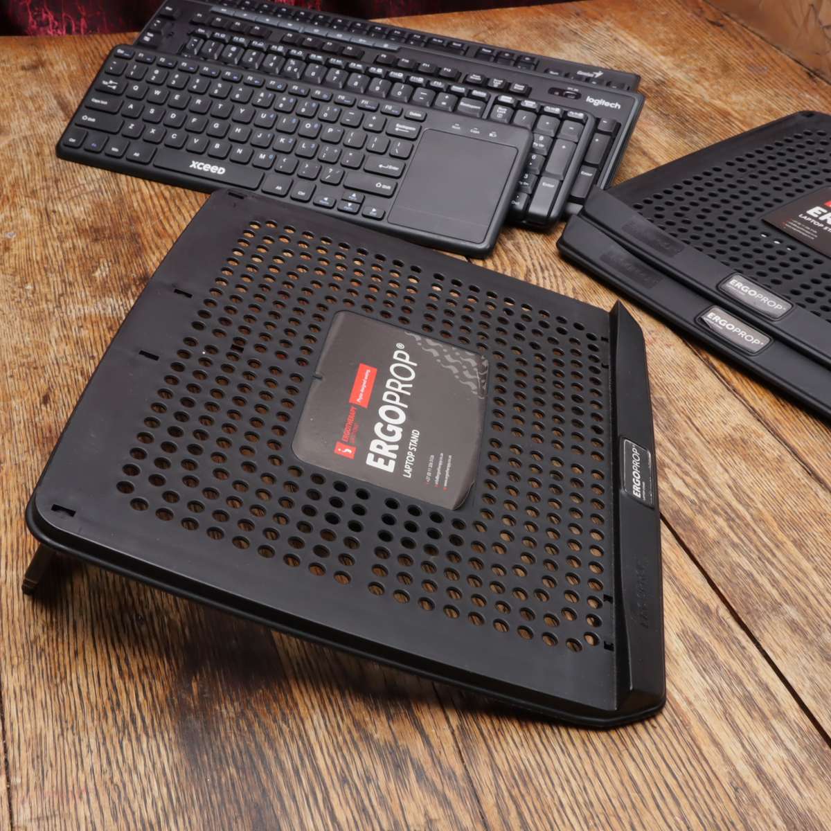 Assorted Wireless Keyboards and Laptop Stands