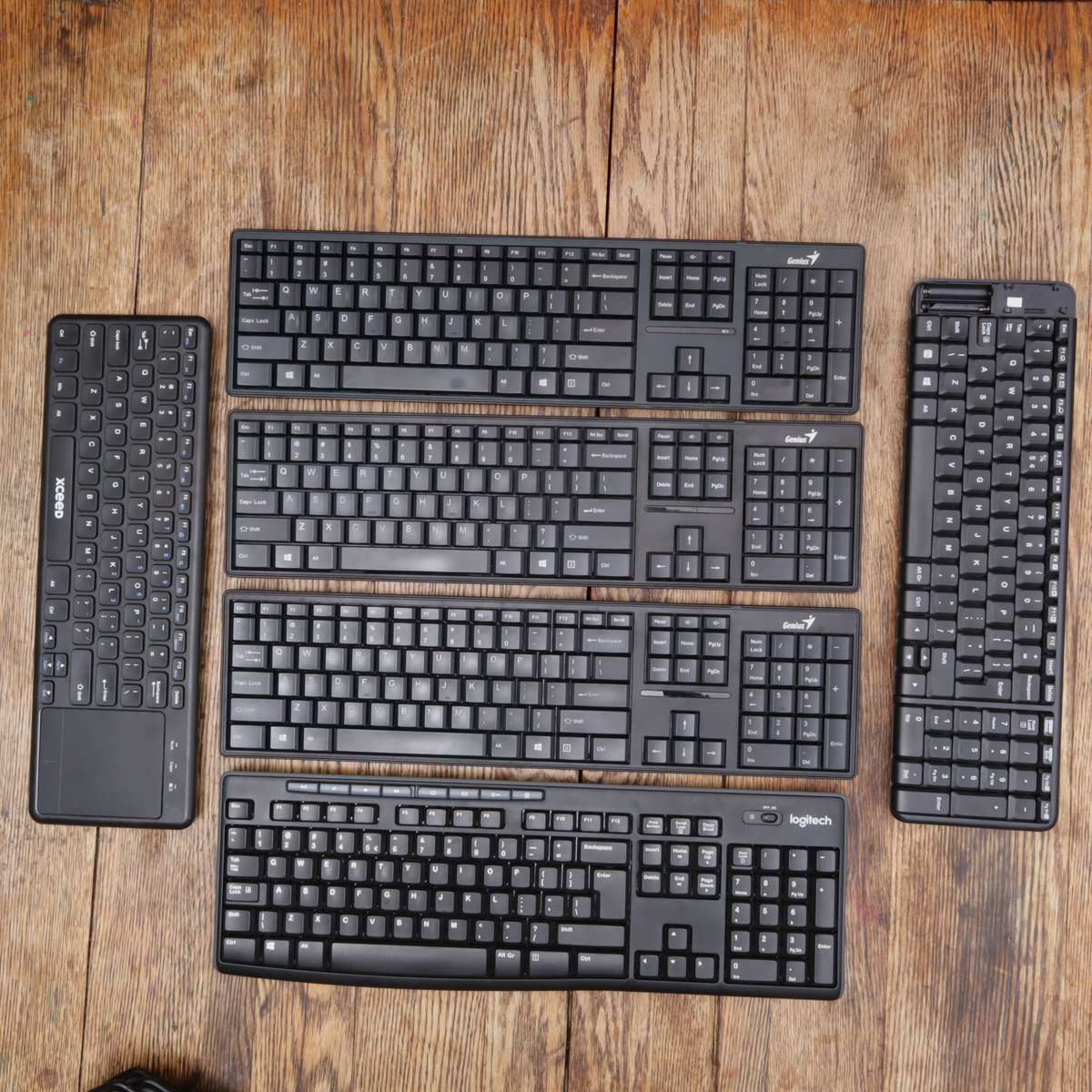 Assorted Wireless Keyboards and Laptop Stands