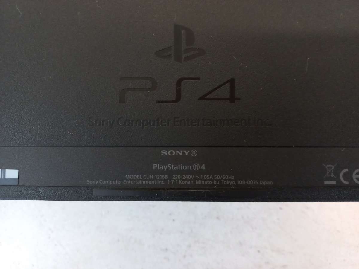 Sony PlayStation 4  1TB Console (CUH-1216B) + 2 Games