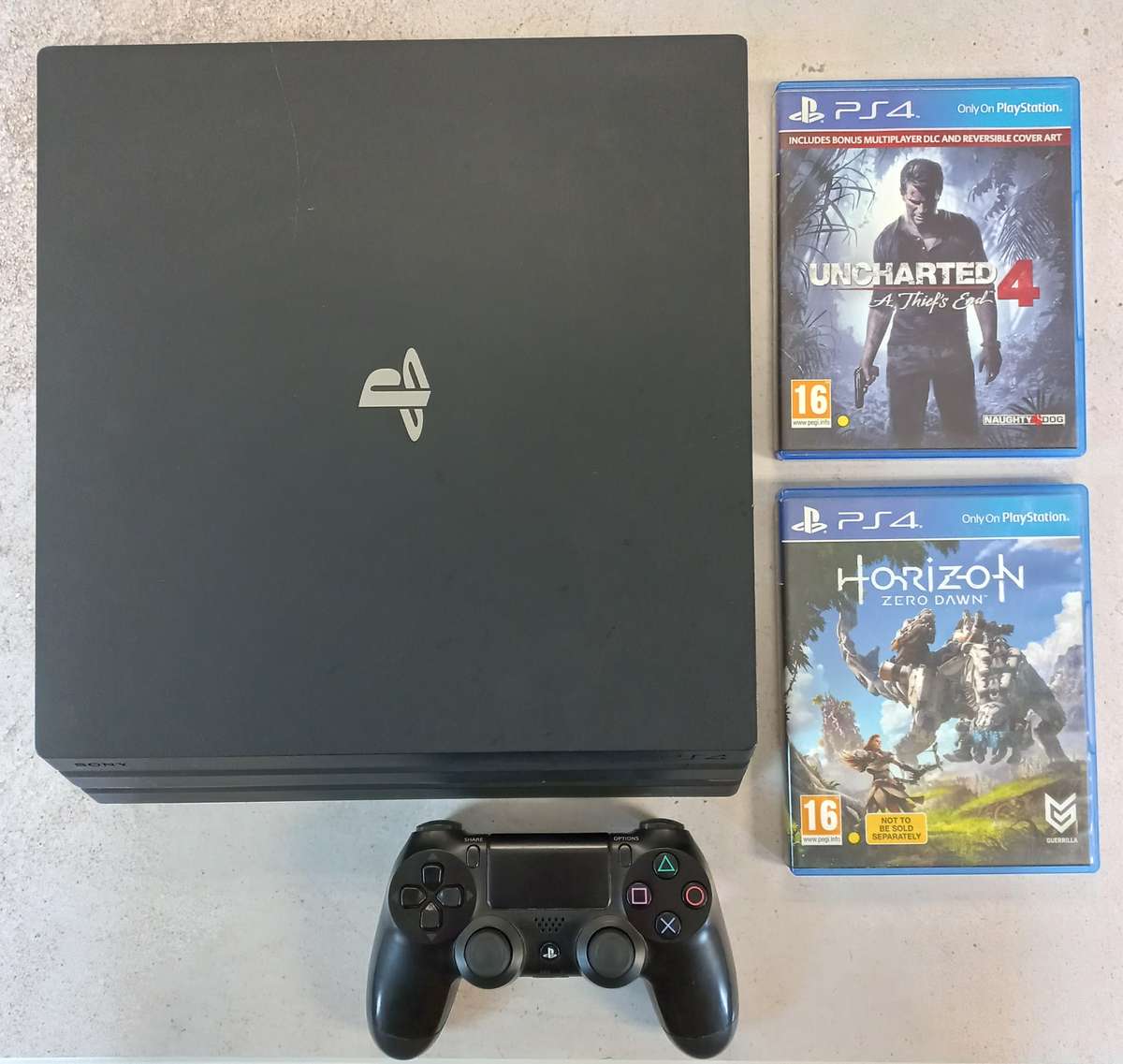 Sony PlayStation 4 Pro Console + 2 Games