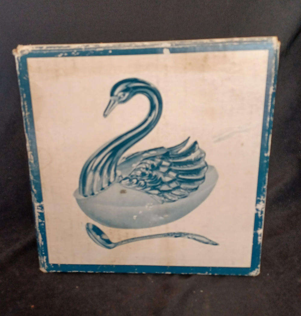 Vintage silver plated swan sugar cellar on frosted glass