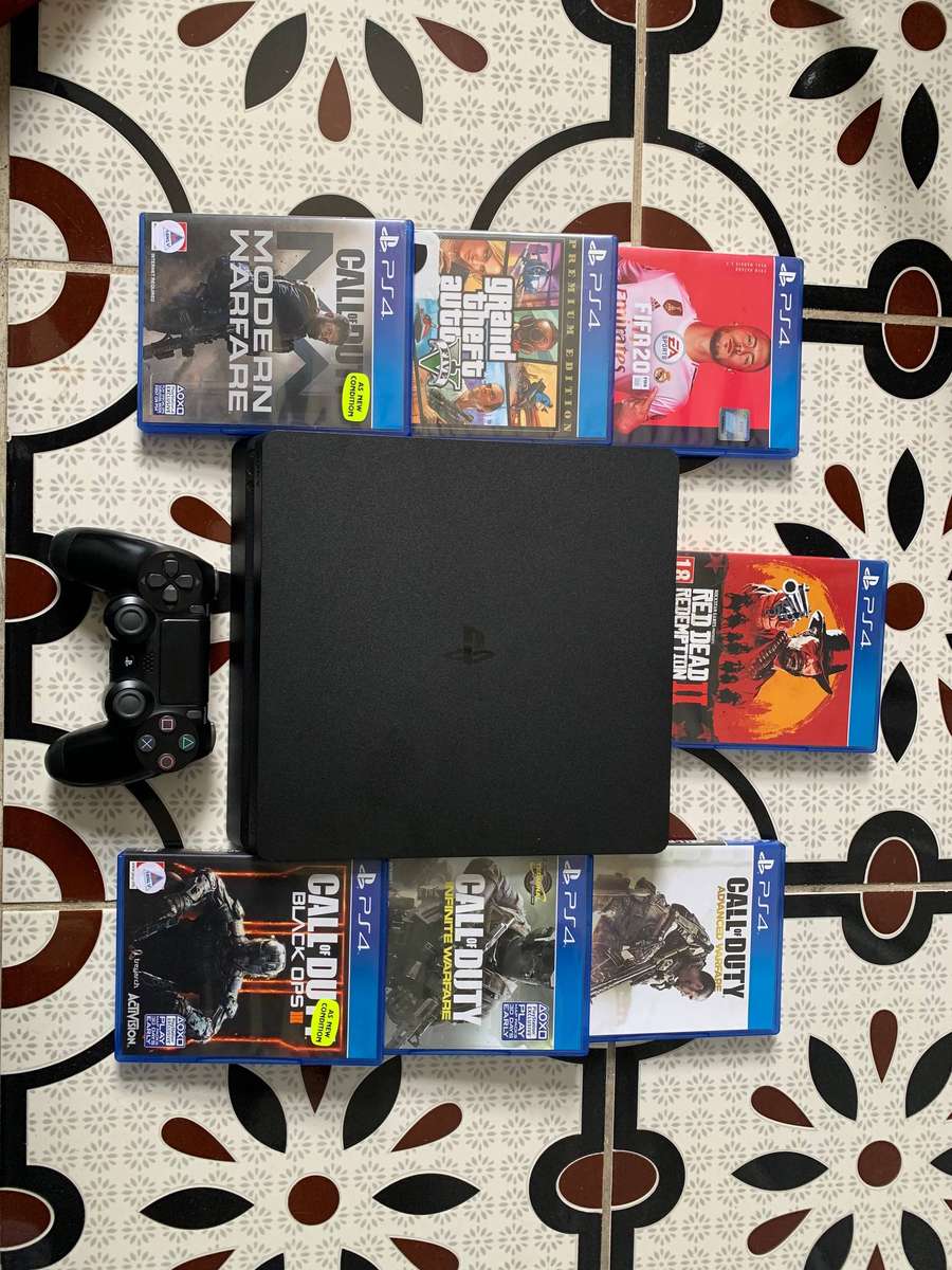 Sony PlayStation 4 Slim (500GB SSD)  Bundle with 7 Games + Accessories