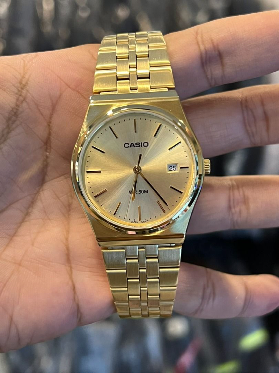 Casio MTP analog gold-tone wristwatch.