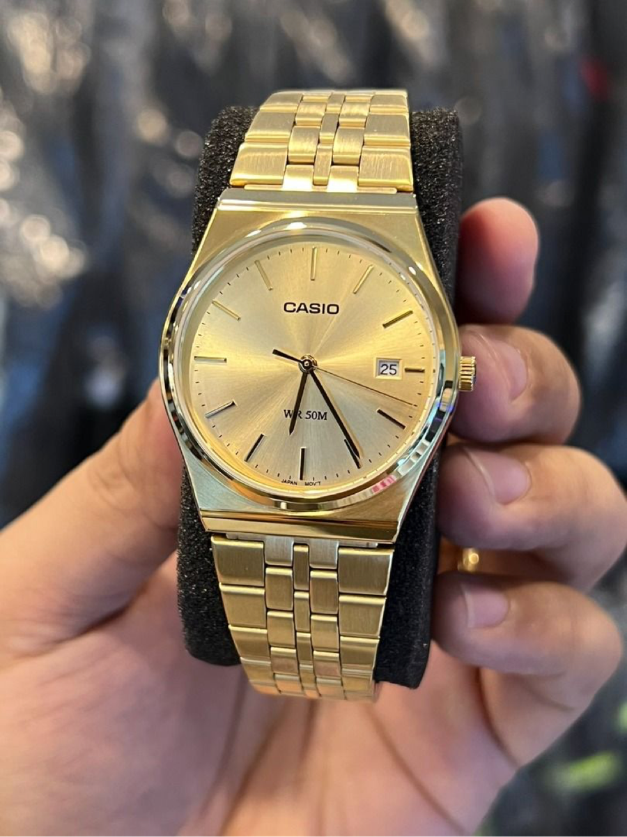 Casio MTP analog gold-tone wristwatch.