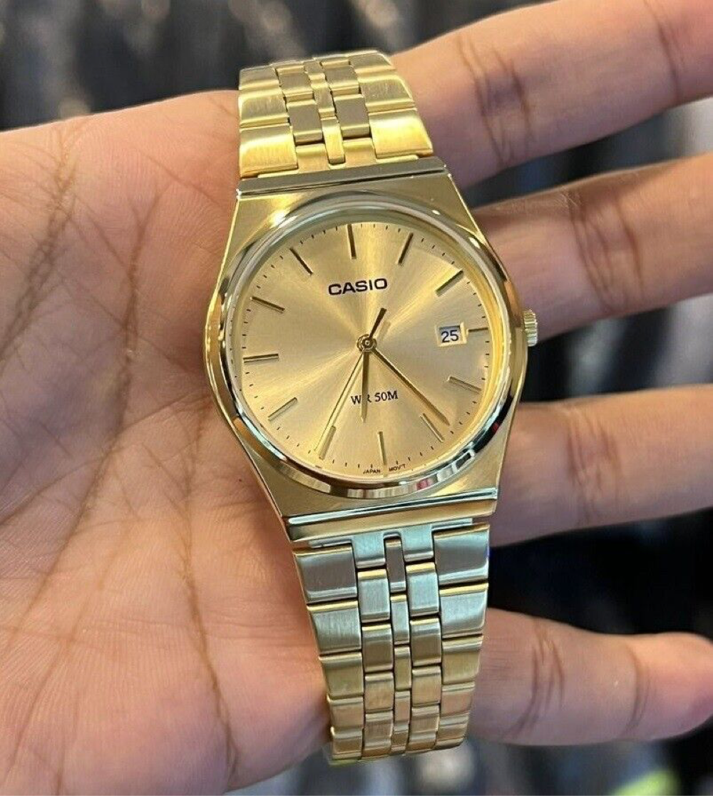 Casio MTP analog gold-tone wristwatch.