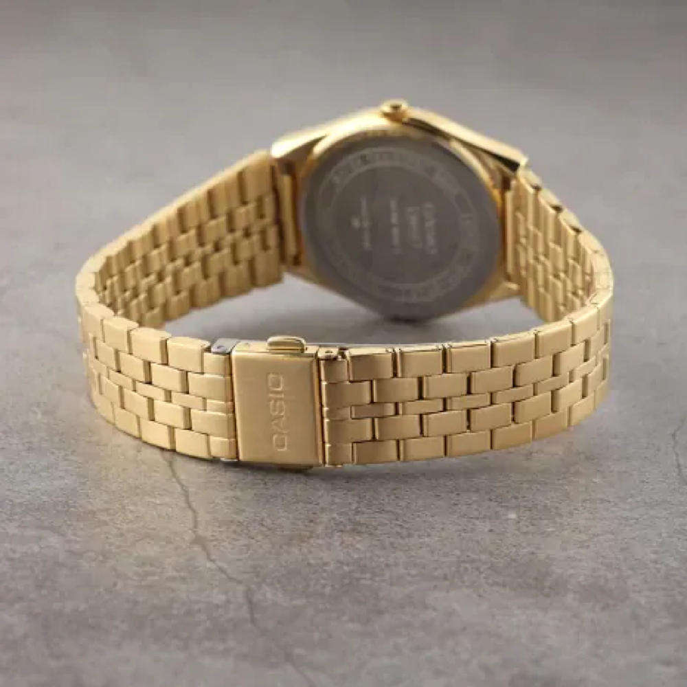 Casio MTP analog gold-tone wristwatch.