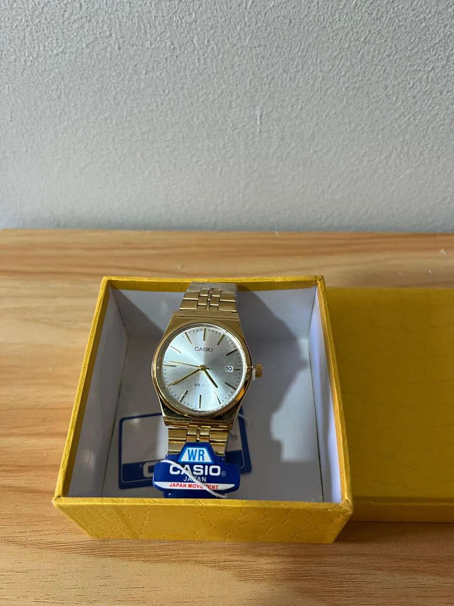 Casio MTP analog gold-tone wristwatch.