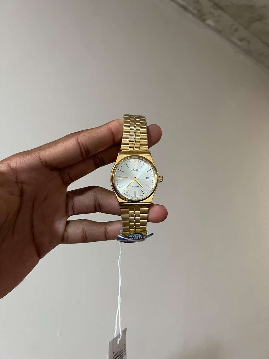 Casio MTP analog gold-tone wristwatch.