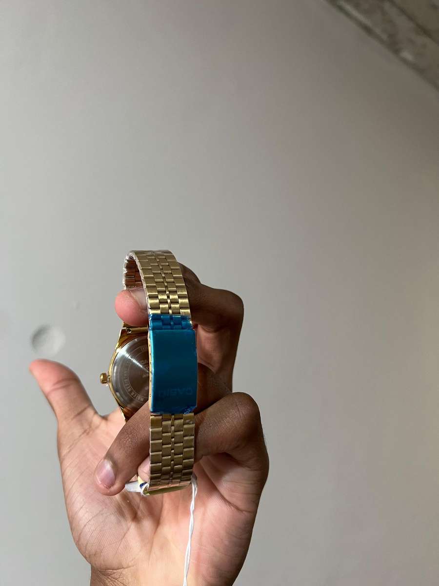 Casio MTP analog gold-tone wristwatch.