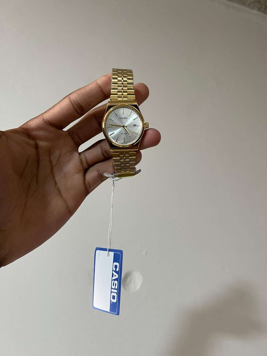 Casio MTP analog gold-tone wristwatch.