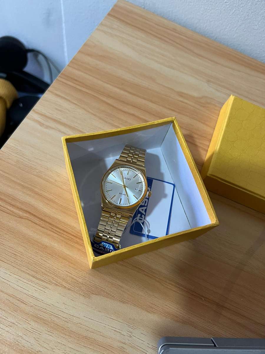 Casio MTP analog gold-tone wristwatch.