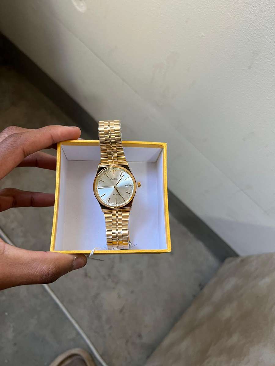 Casio MTP analog gold-tone wristwatch.