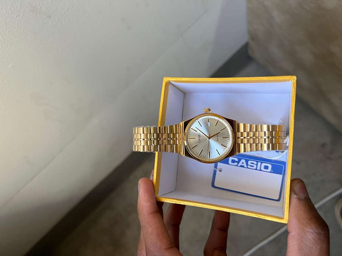 Casio MTP analog gold-tone wristwatch.