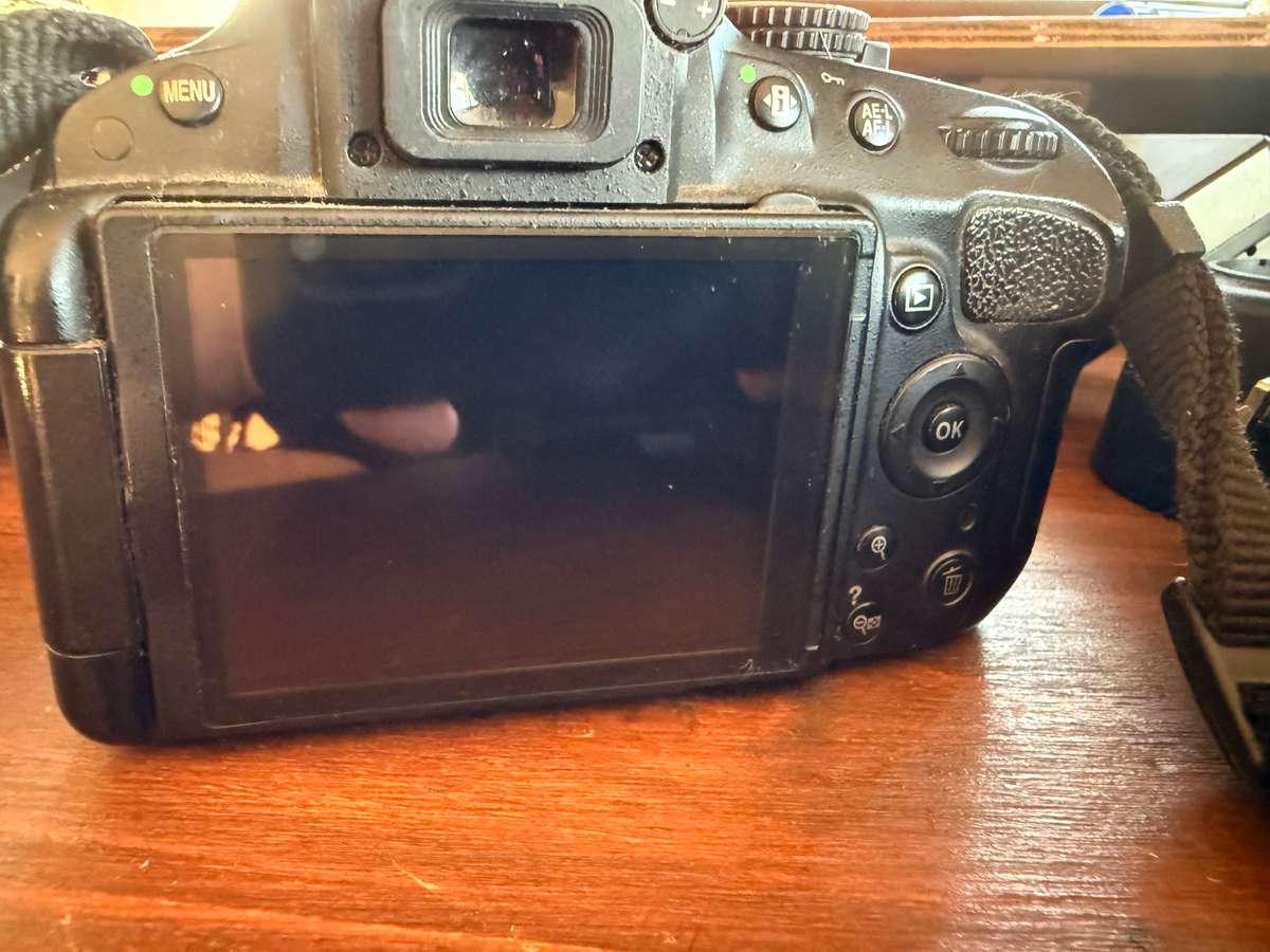 Nikon D5100 DSLR camera with 2 lenses, flash and spare batteries and charger