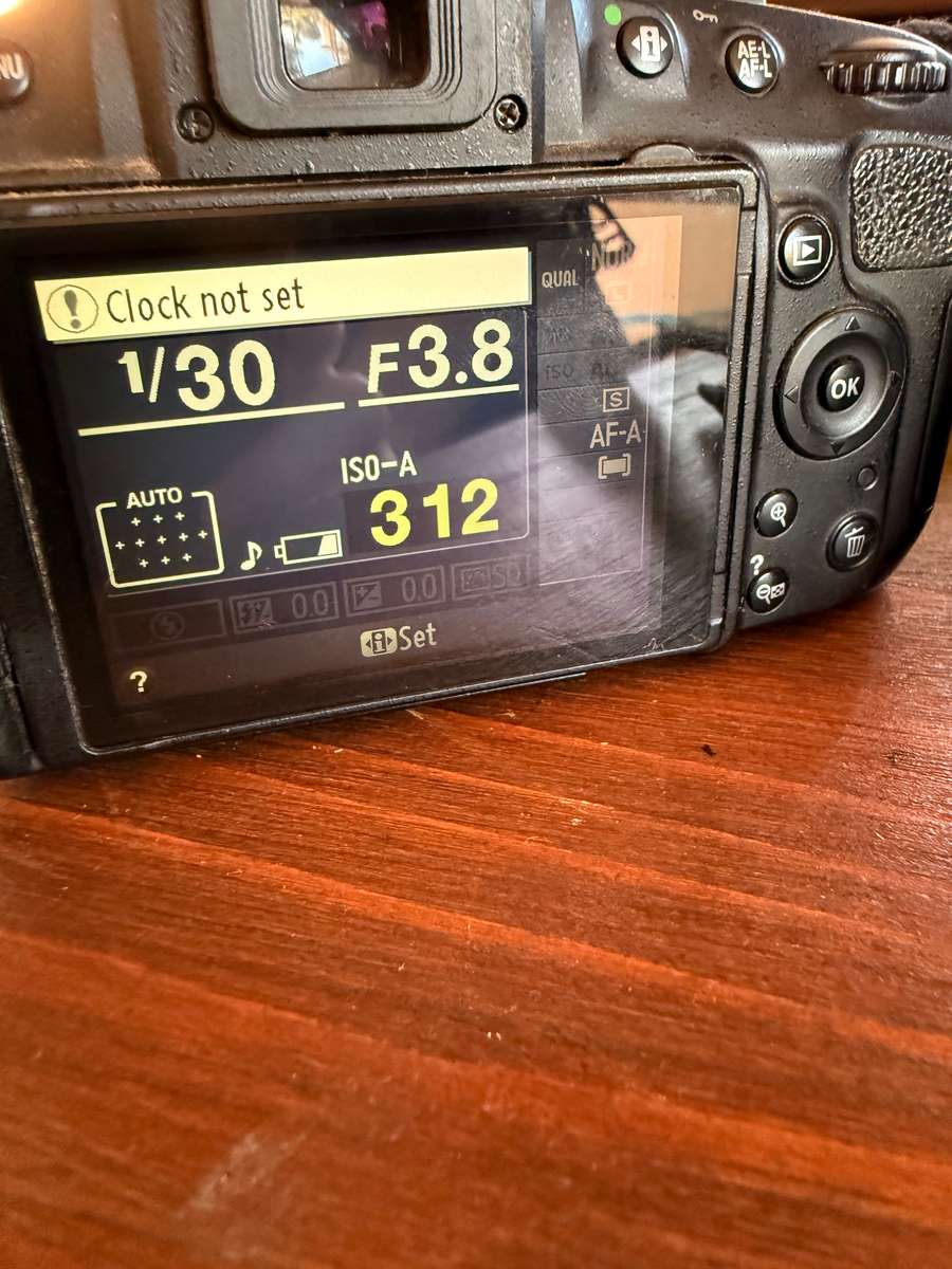 Nikon D5100 DSLR camera with 2 lenses, flash and spare batteries and charger