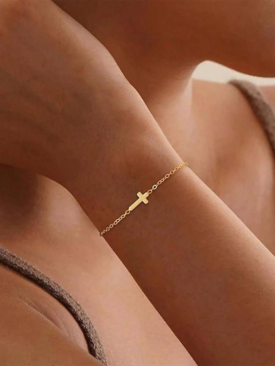 Gold tone delicate cross bracelet