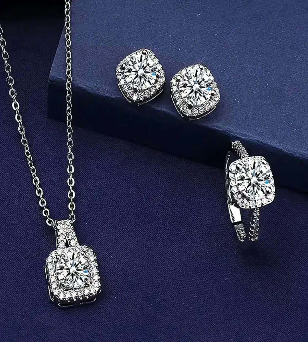 Gorgeous four piece jewelry set- Earrings, necklace, pendant and ring.