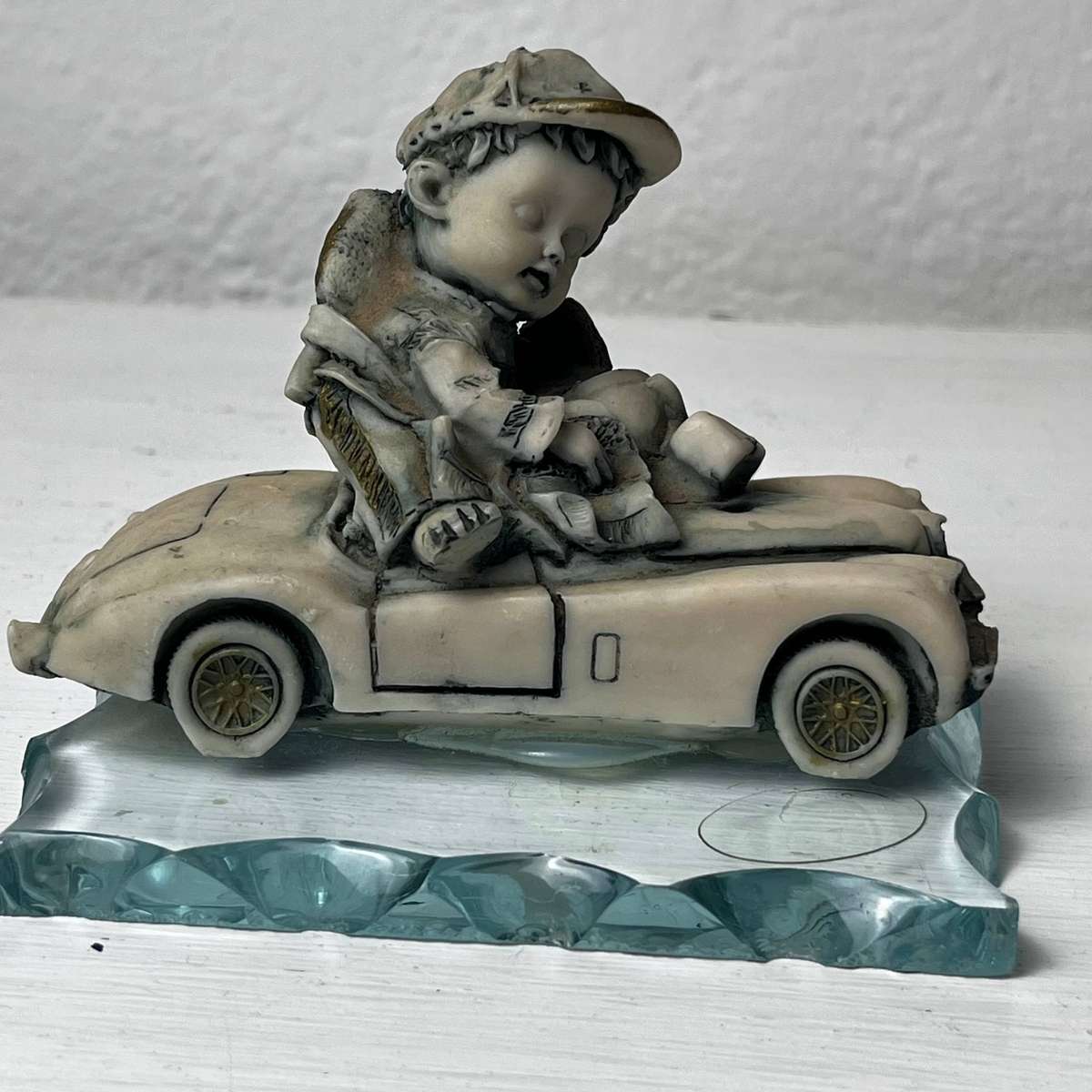 Vintage Boy in Car Figurine on Glass Base 10cm
